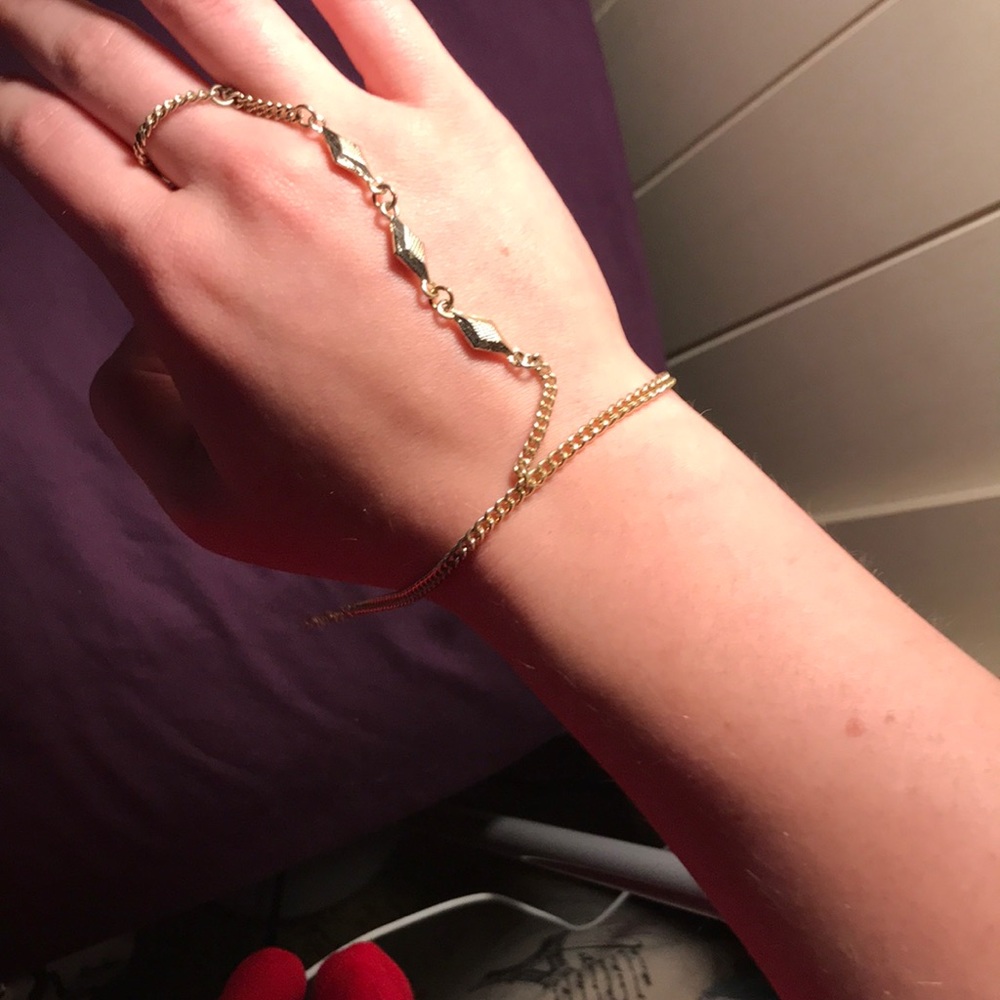 Finger attached bracelet